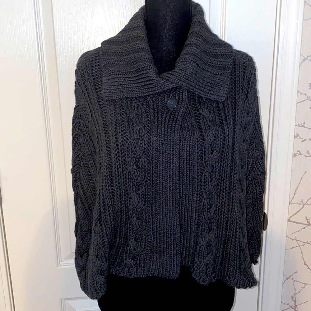 Dark gray braided sweater poncho.